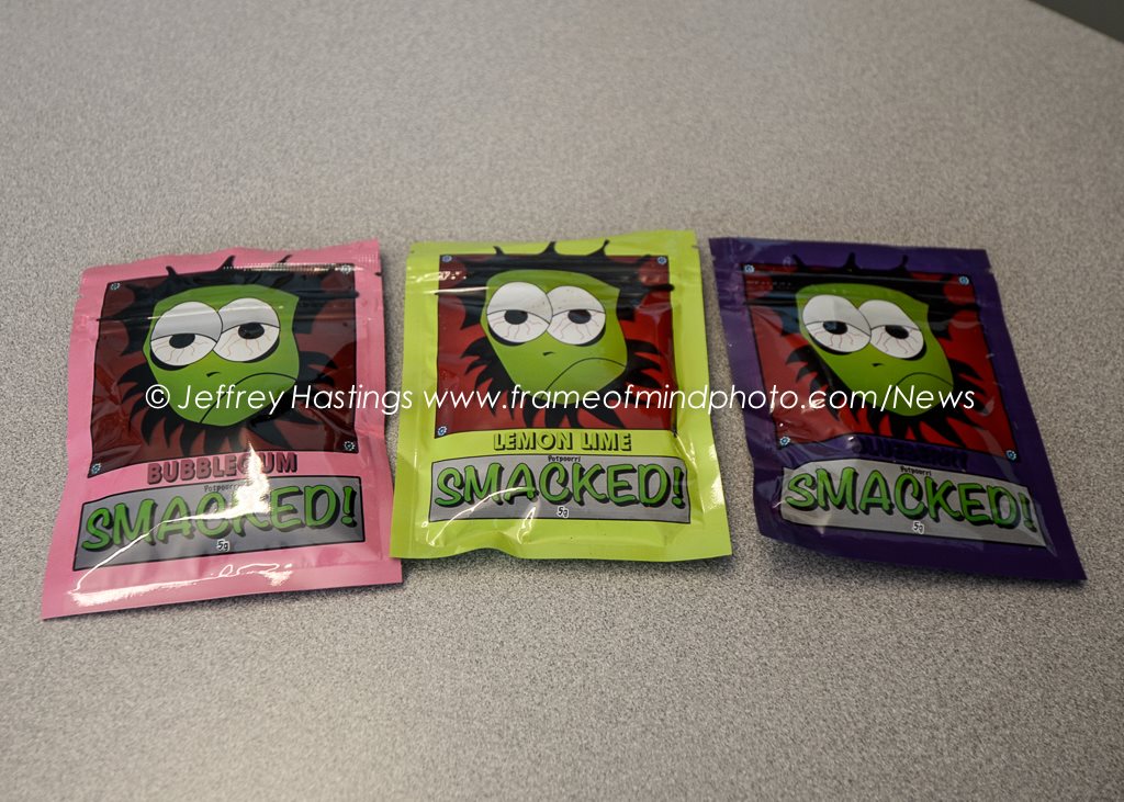 Packets of Smacked, thought to be a synthetic cannabinoid, which was involved in a number of recent overdoses in Manchester, NH. Photo by Jeffrey Hastings.