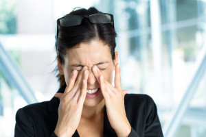 Woman with eye irritation